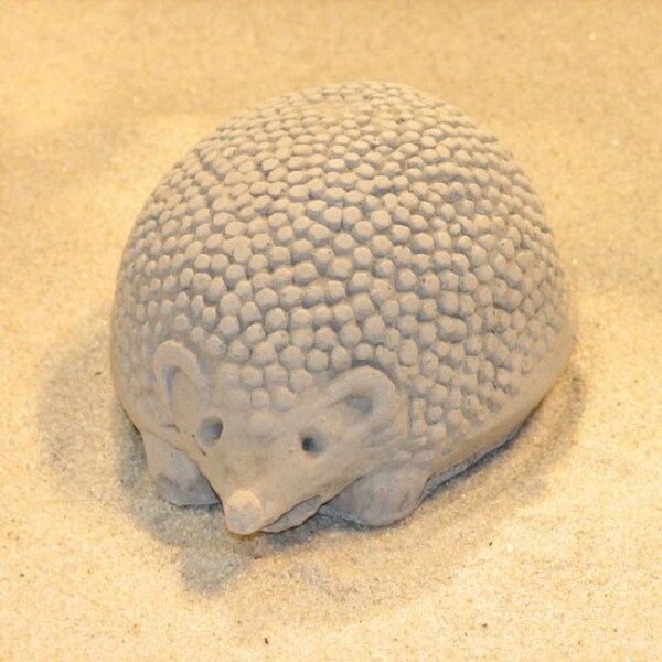 Small garden hedgehog in cement